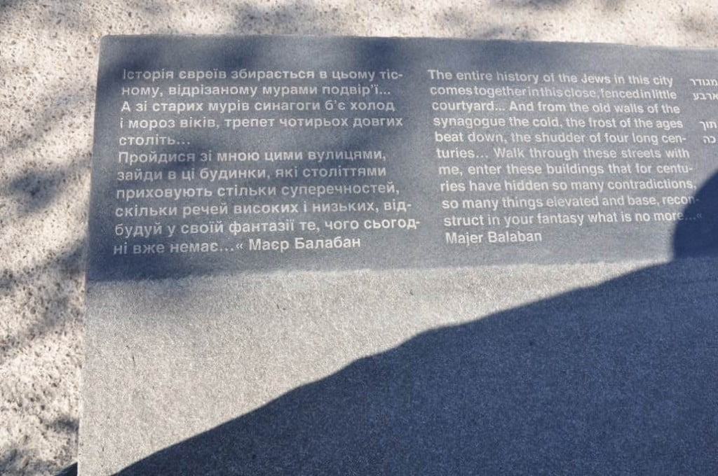 Multi-lingual plaque for the memorial site under construction