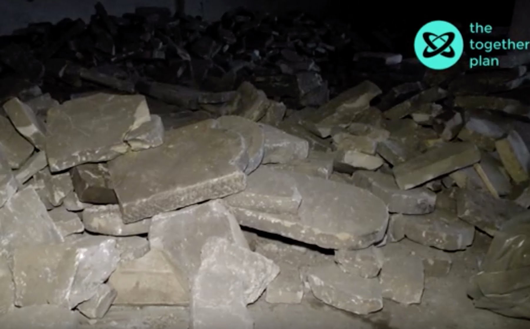 Piles up rescued matzevot in Brest. Screen grab from together Plan video