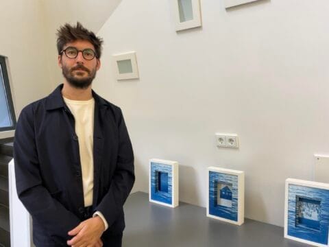 Bence Illyes with the exhibited cyanotype prints