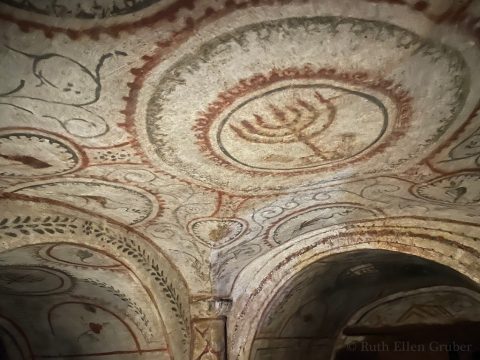 Painted decoration showing a menorah in the villa Torlonia Jewish catacomb