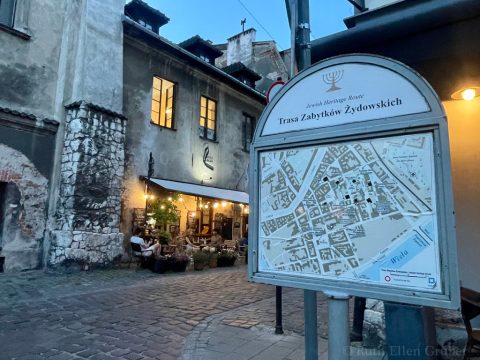 On a warm summer evening, a tourist map of Jewish heritage sites in Krakow's Kazimierz
