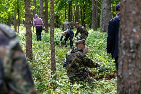 German soldiers clean up the Jewish cemetery in Merkinė. Photo courtesy of Sergey Kanovich